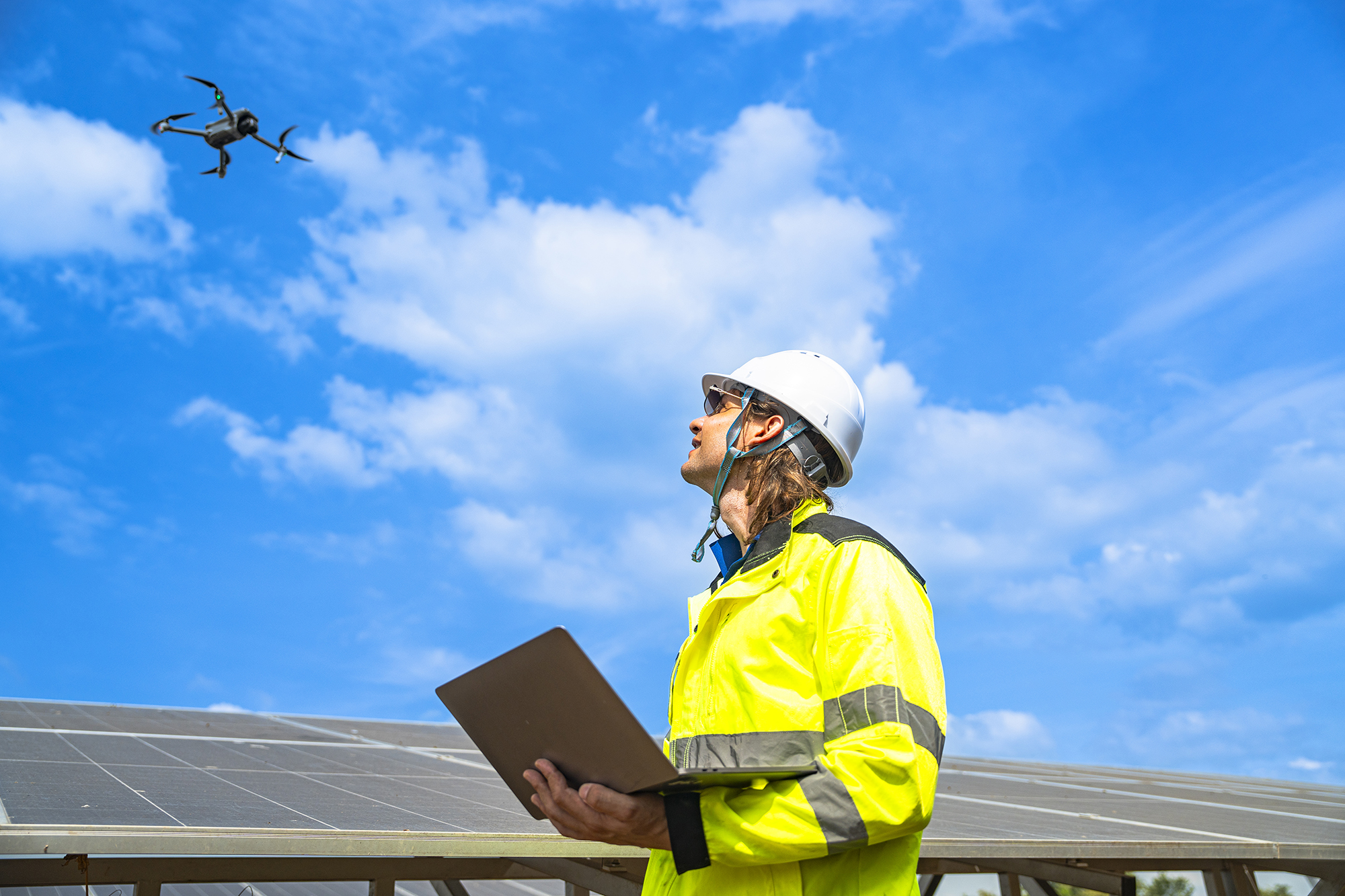 Engineer launching drone for roof inspection in Croydon